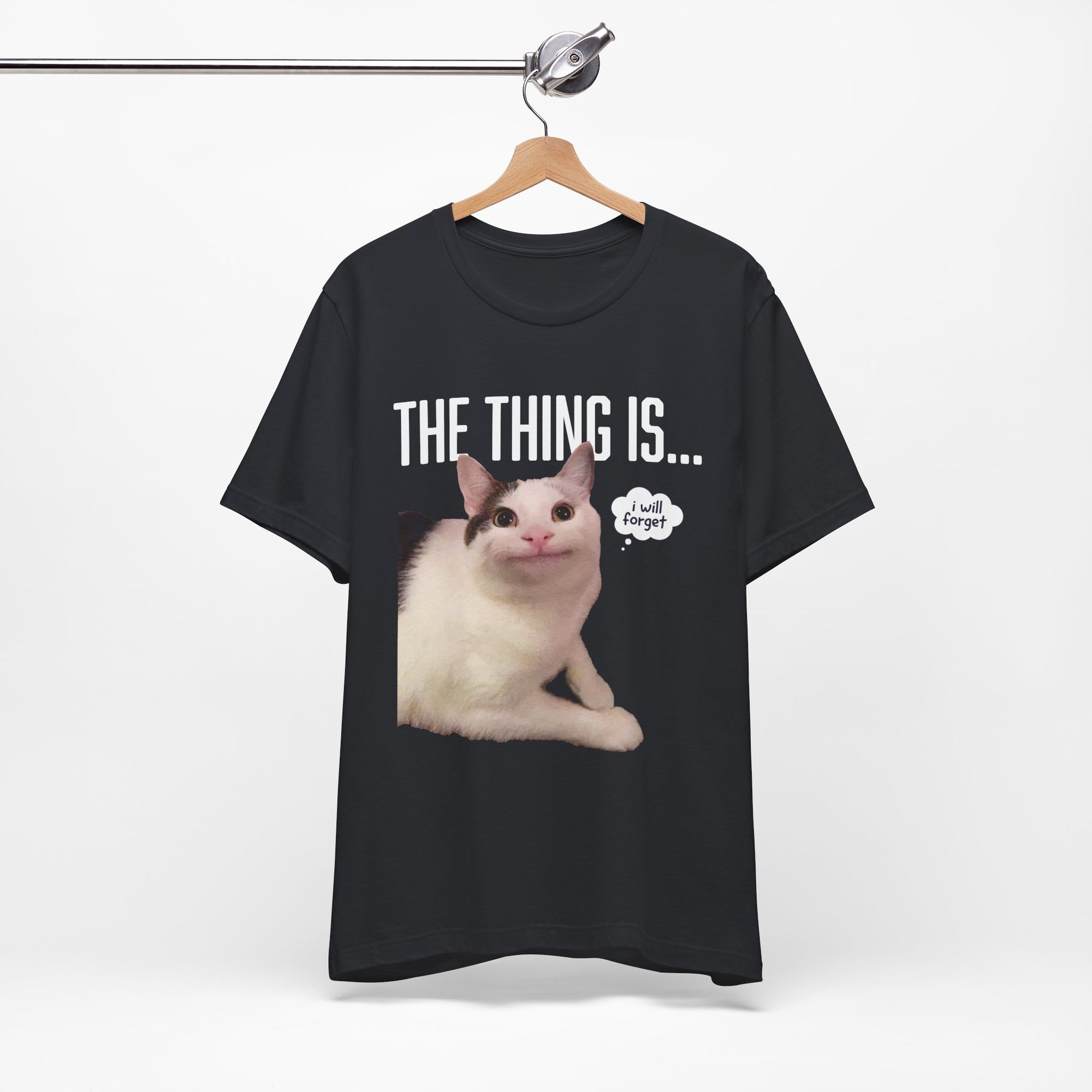 Black t-shirt with a cat graphic and text on a hanger against a white background