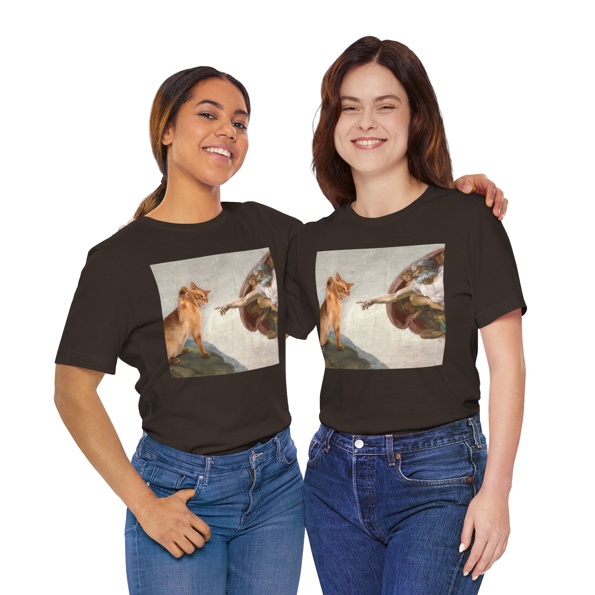 Two people wearing black t-shirts with artistic prints of a woman and a dog.