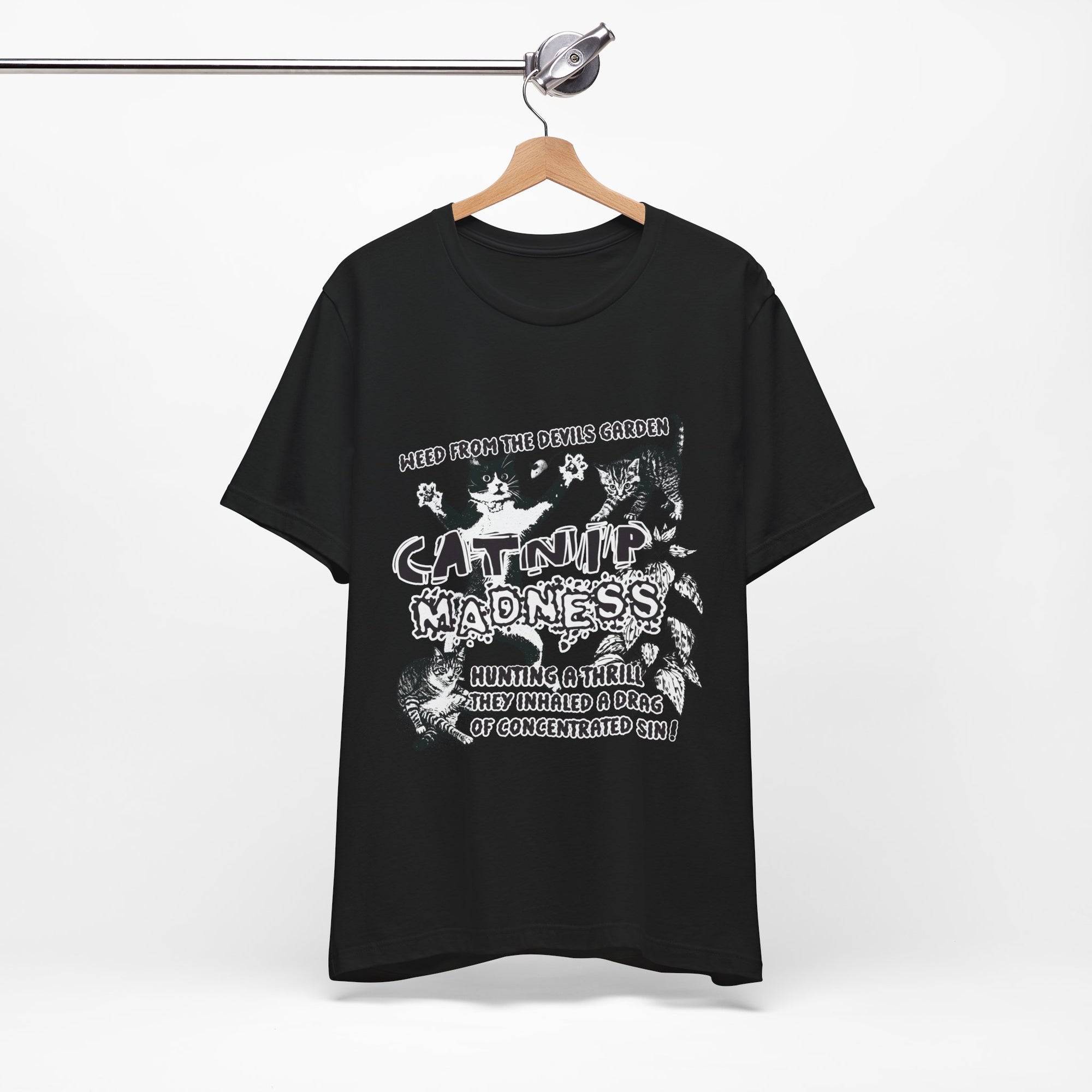 Black t-shirt with white graphic design on a hanger against a white background