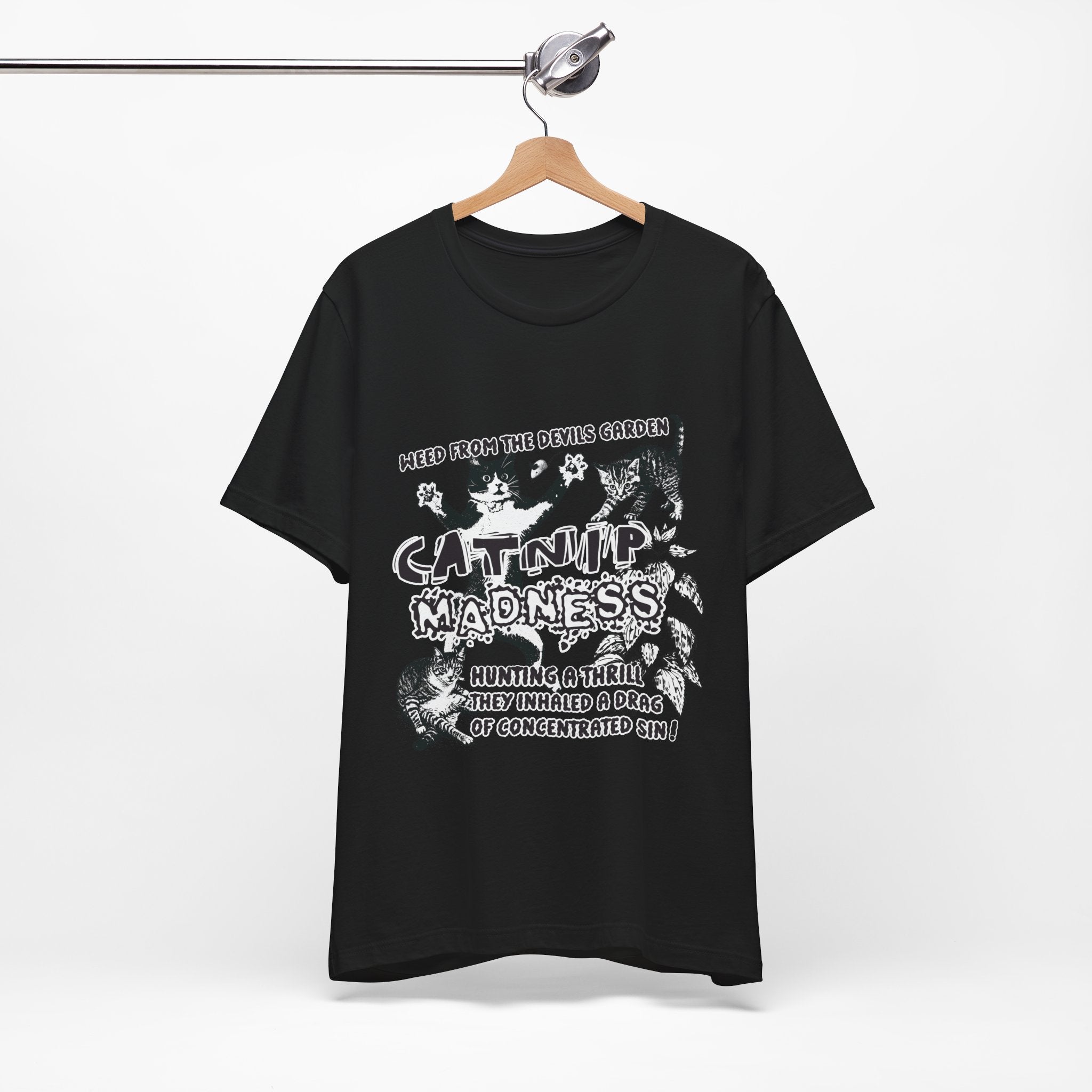 Black t-shirt with white graphic design on a hanger against a white background