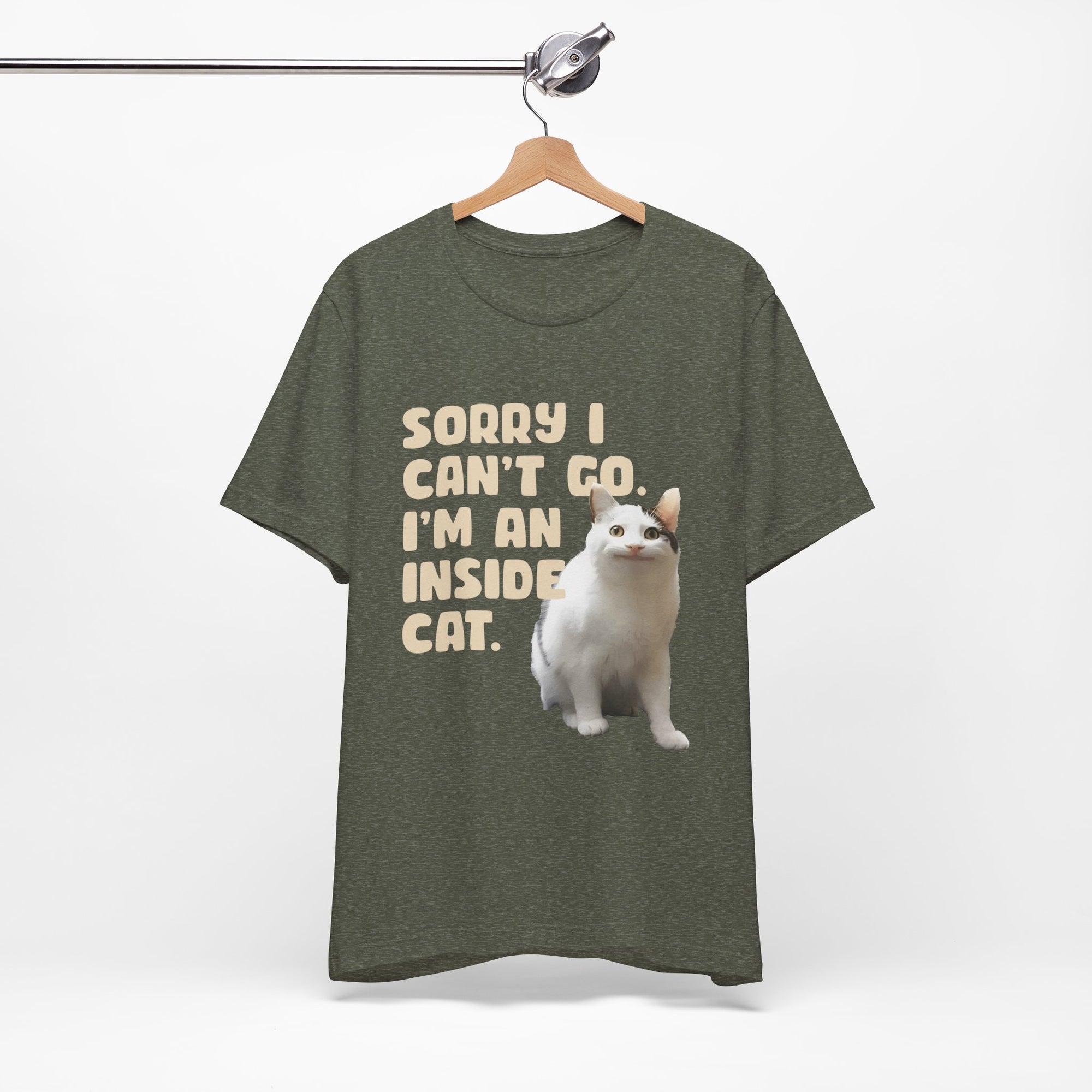 Brown t-shirt with a cat graphic and text on a hanger against a white background