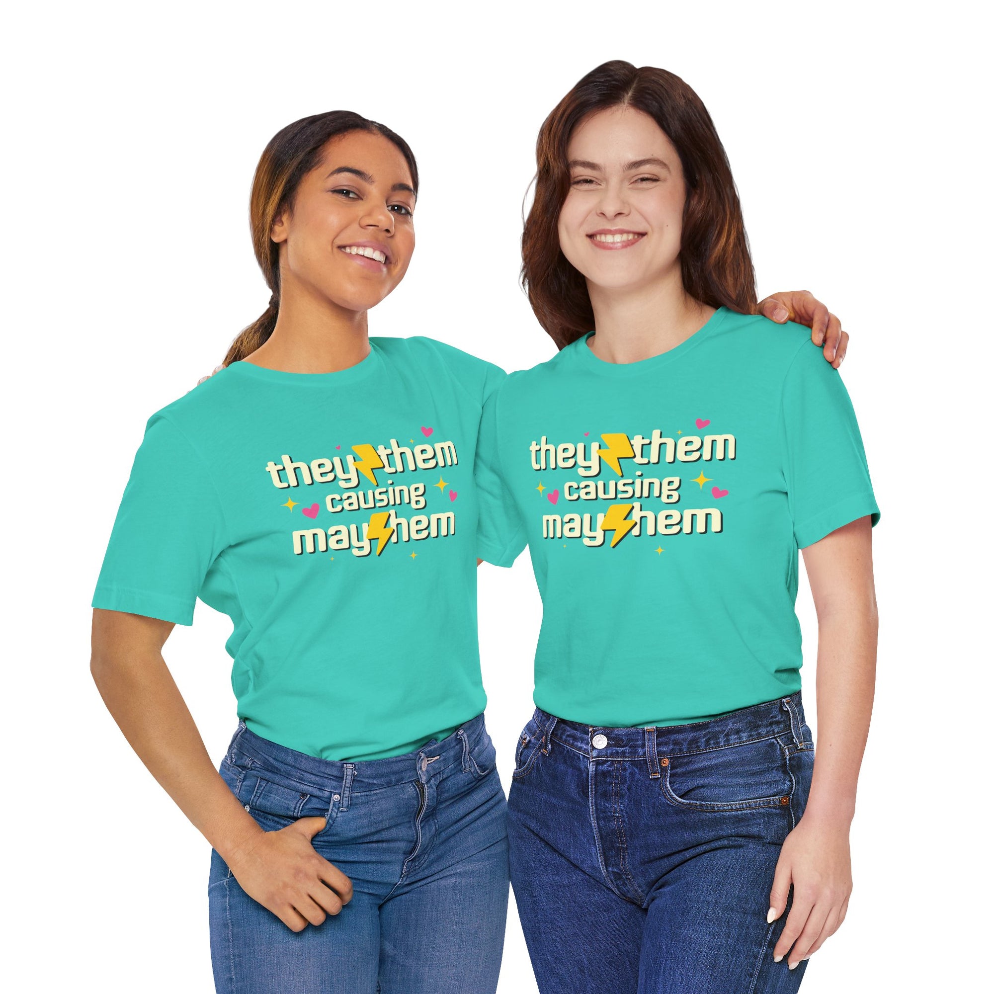Two people wearing turquoise t-shirts with 'they them causing mayhem' text.