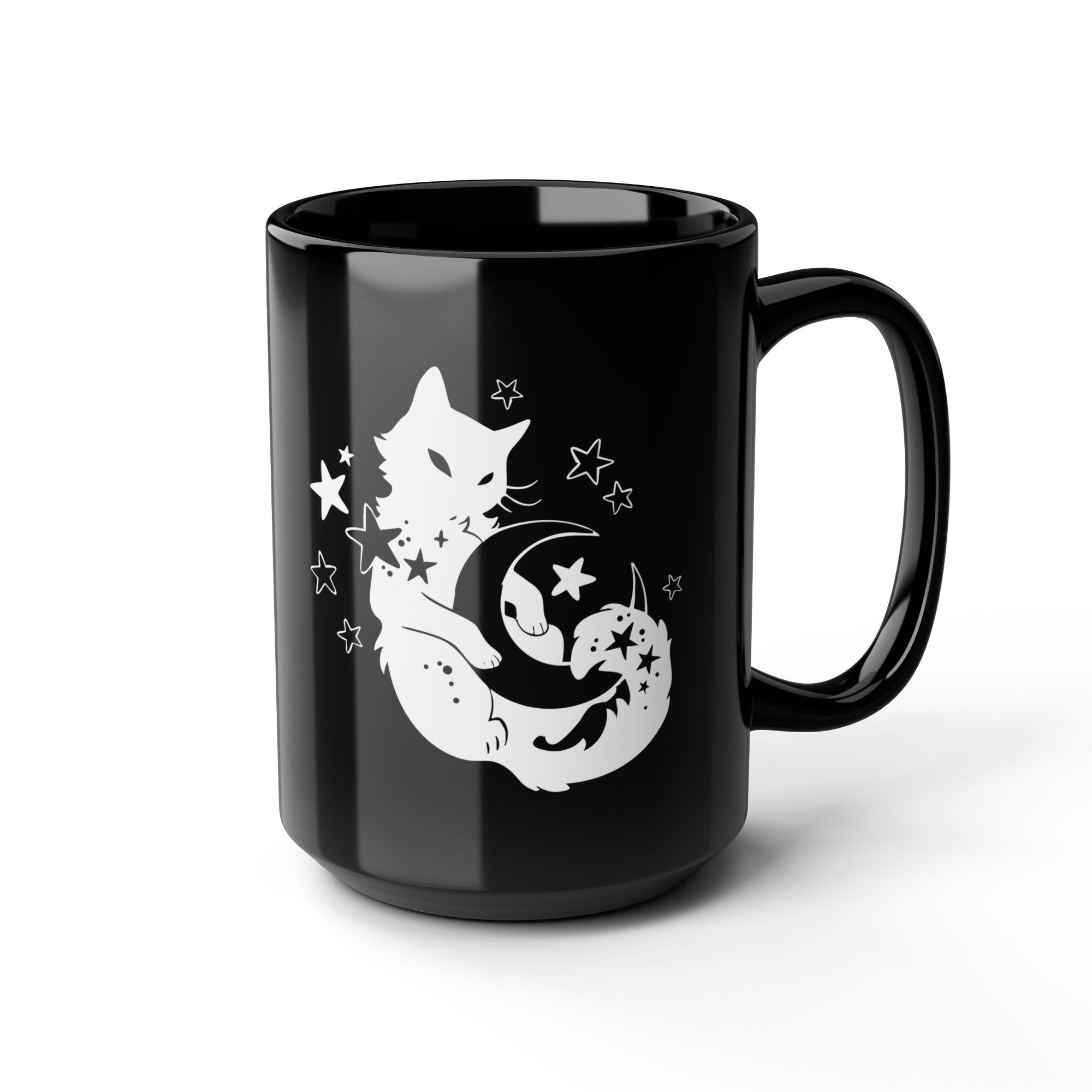 Black mug with a white fox and moon design on a white background