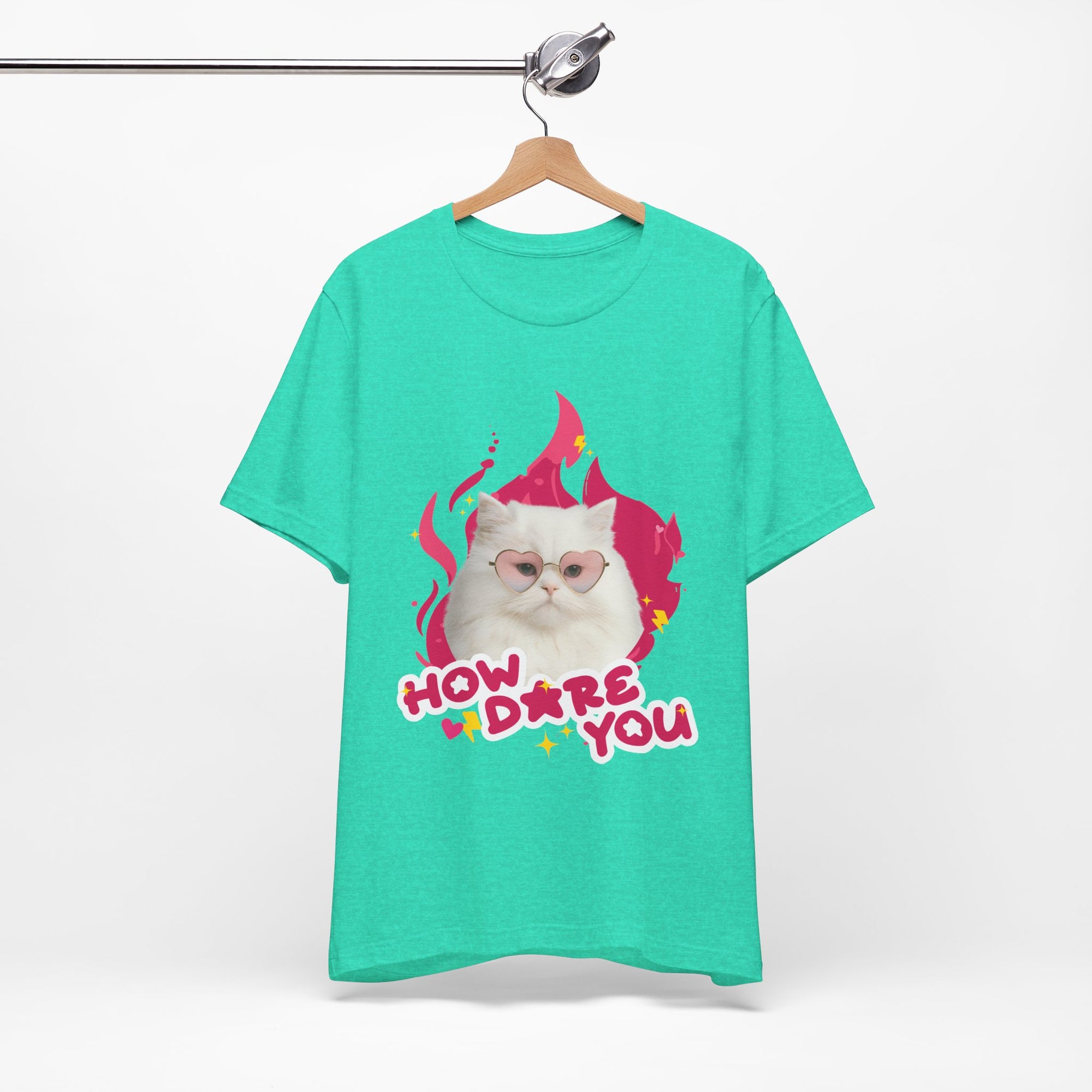 Green t-shirt with a cat graphic and text on a hanger against a white background