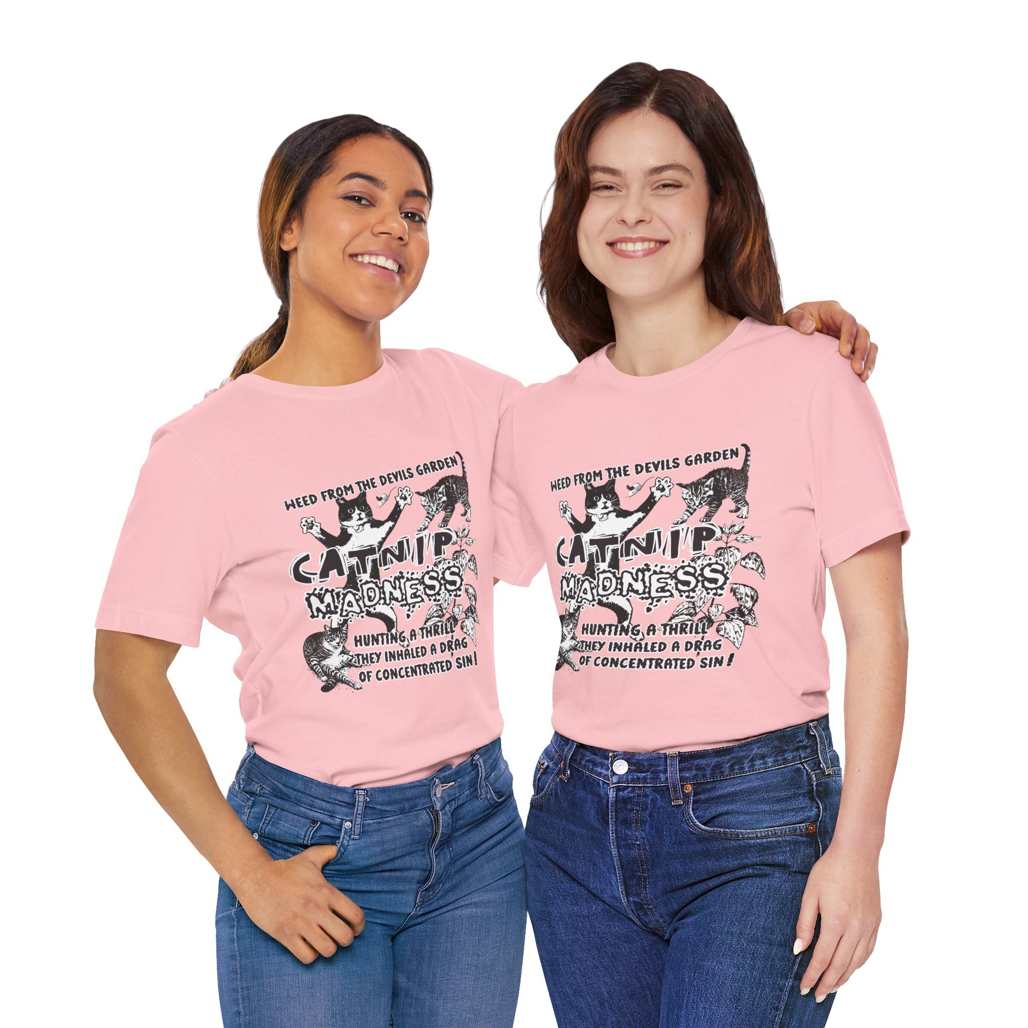 Two women wearing purple t-shirts with a graphic design of a woman holding a gun on a white background.
