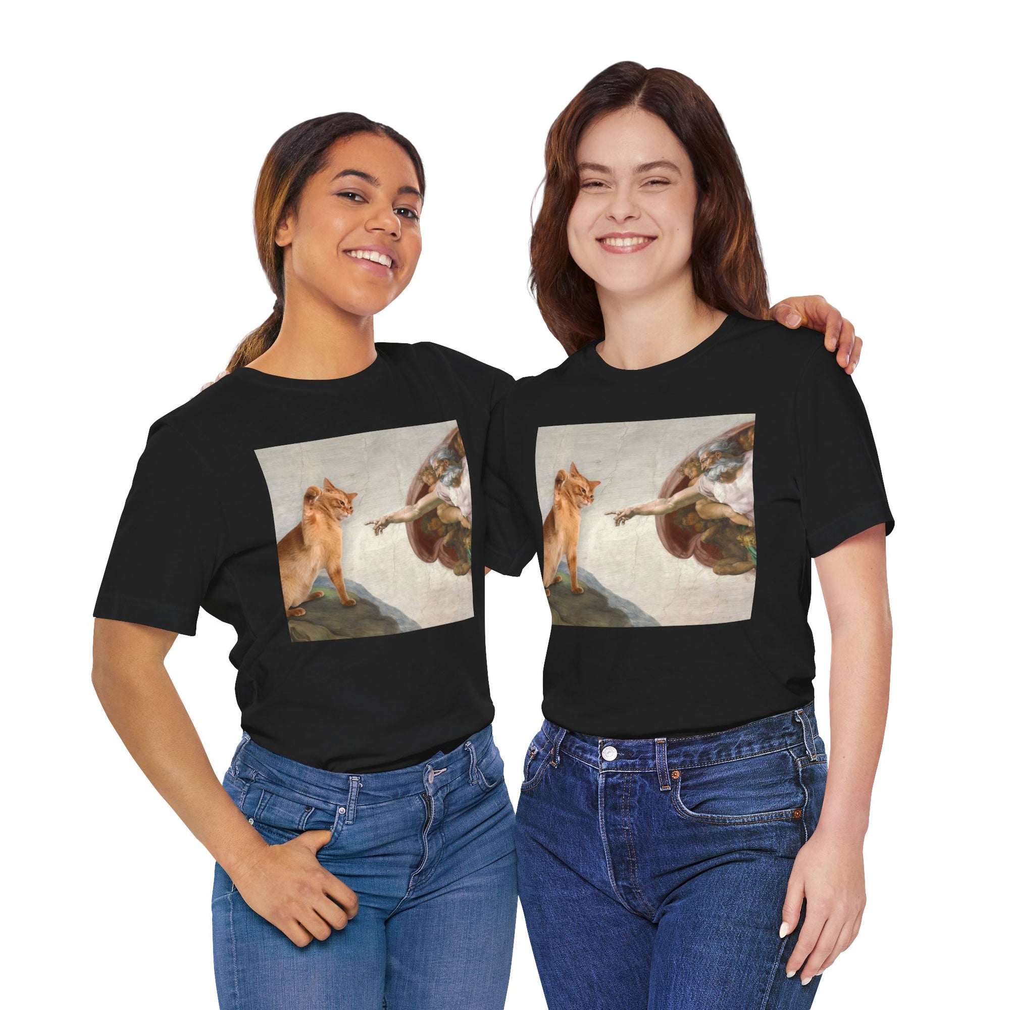Two people wearing black t-shirts with artistic prints of a woman and a dog.