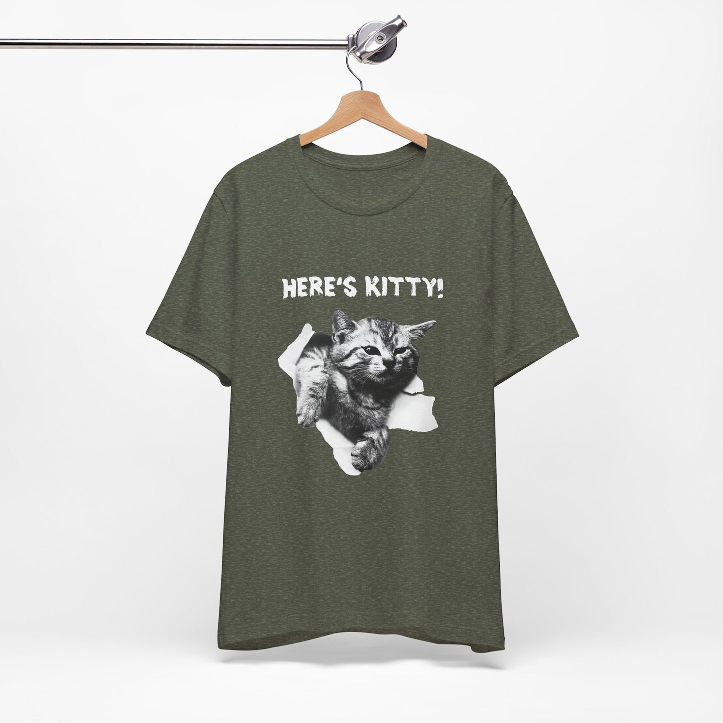 Green t-shirt with a cat graphic and 'HERE'S KITTY!' text on a hanger against a white background