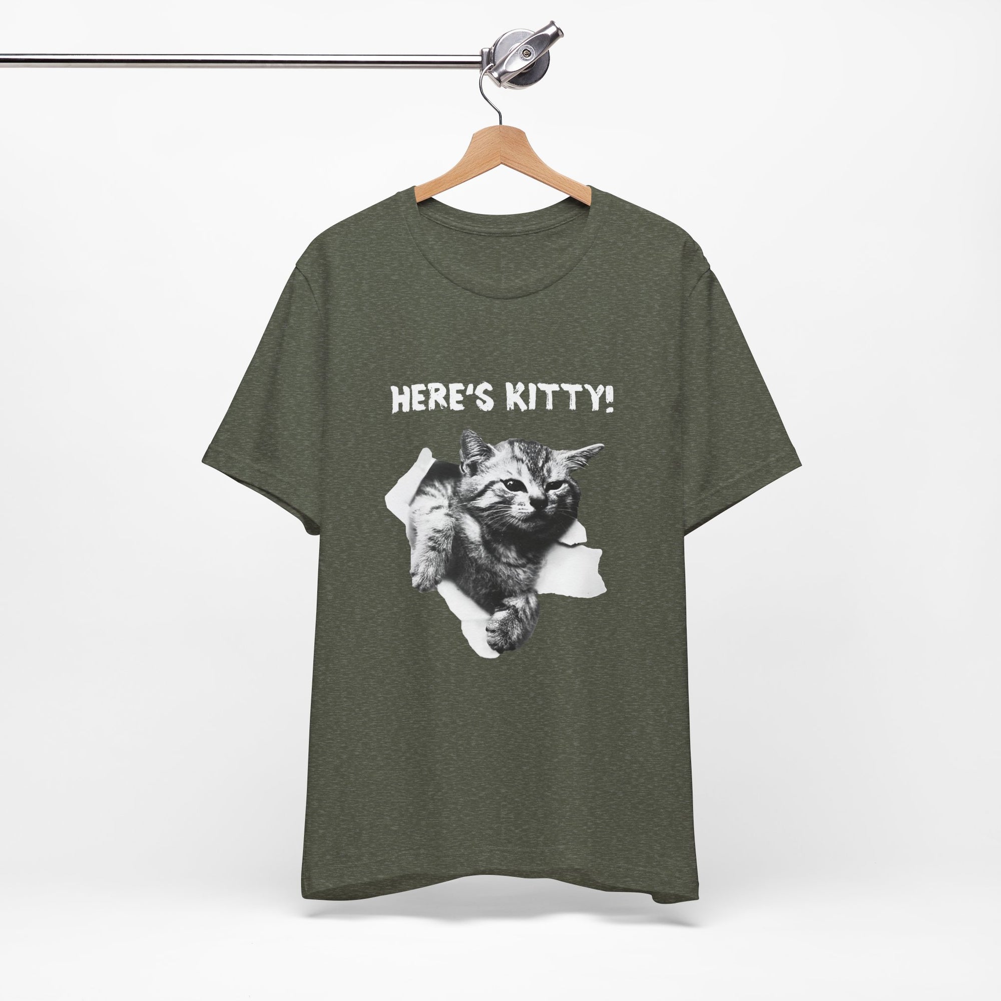 Green t-shirt with a cat graphic and 'HERE'S KITTY!' text on a hanger against a white background