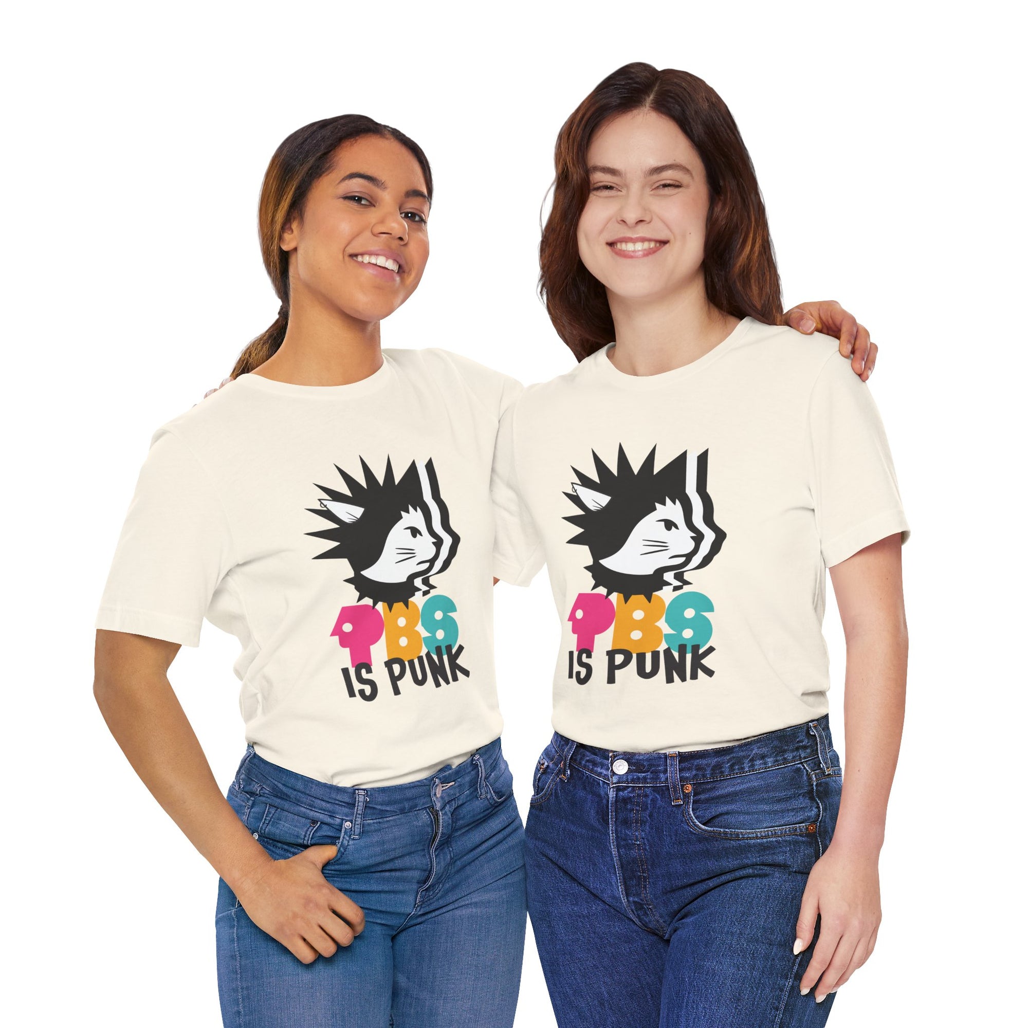 Two people wearing t-shirt featuring a punk-style black cat graphic with colorful letters spelling “PBG” and black text that says “Is Punk.”
