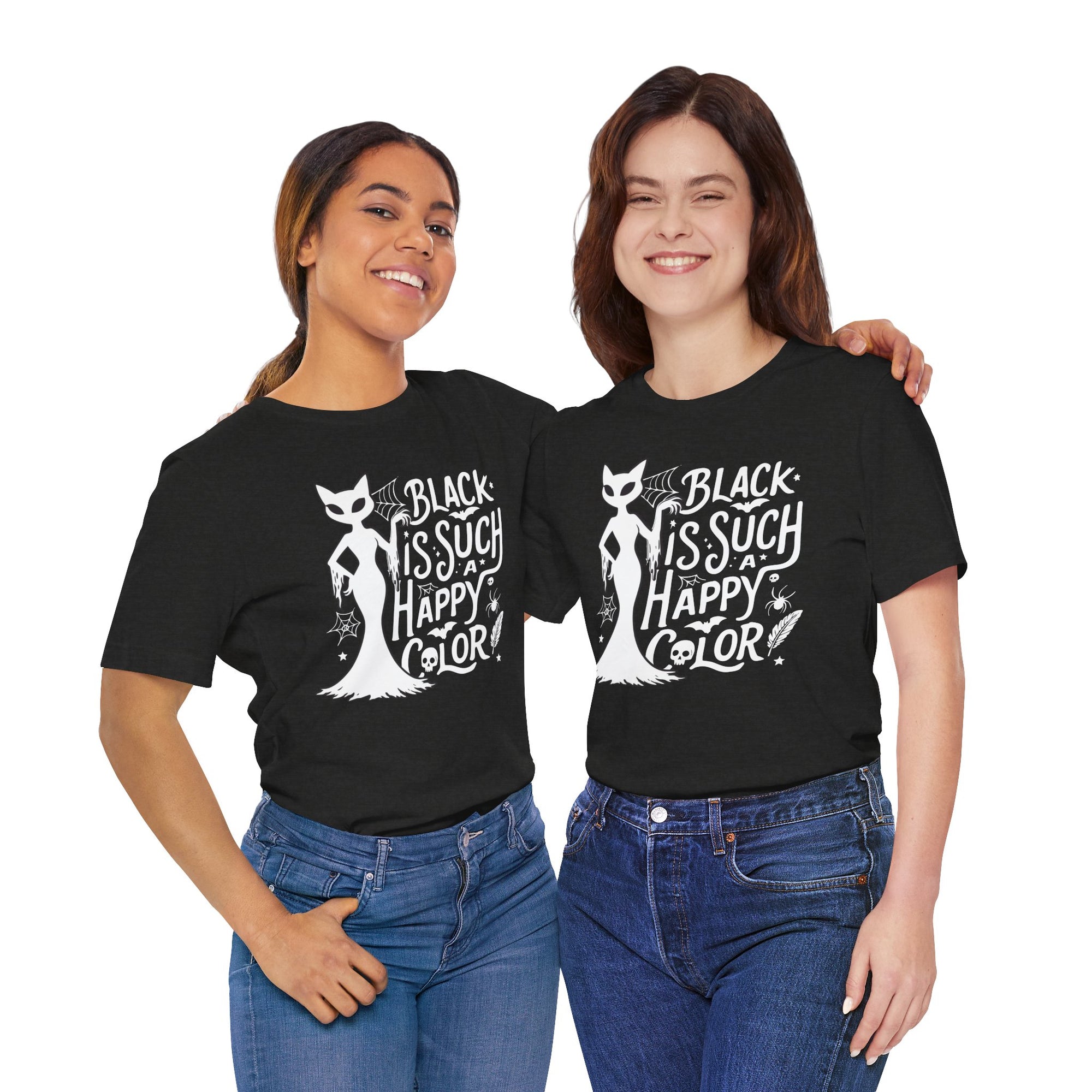 Two people wearing Black t-shirt featuring a white spooky cat graphic with the phrase “Black Is Such a Happy Color,” plus bats, spiderwebs, stars, and Halloween details.
