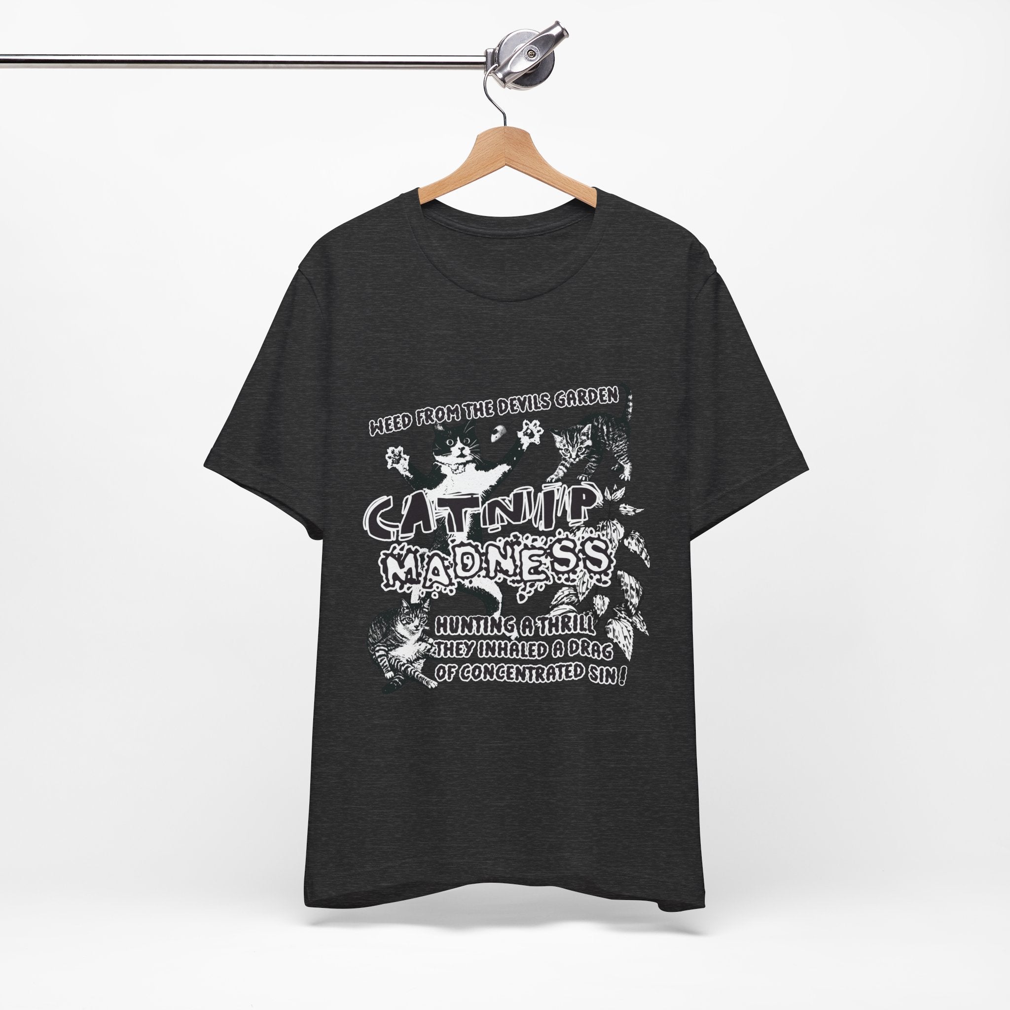 Black t-shirt with white graphic design on a hanger against a white background