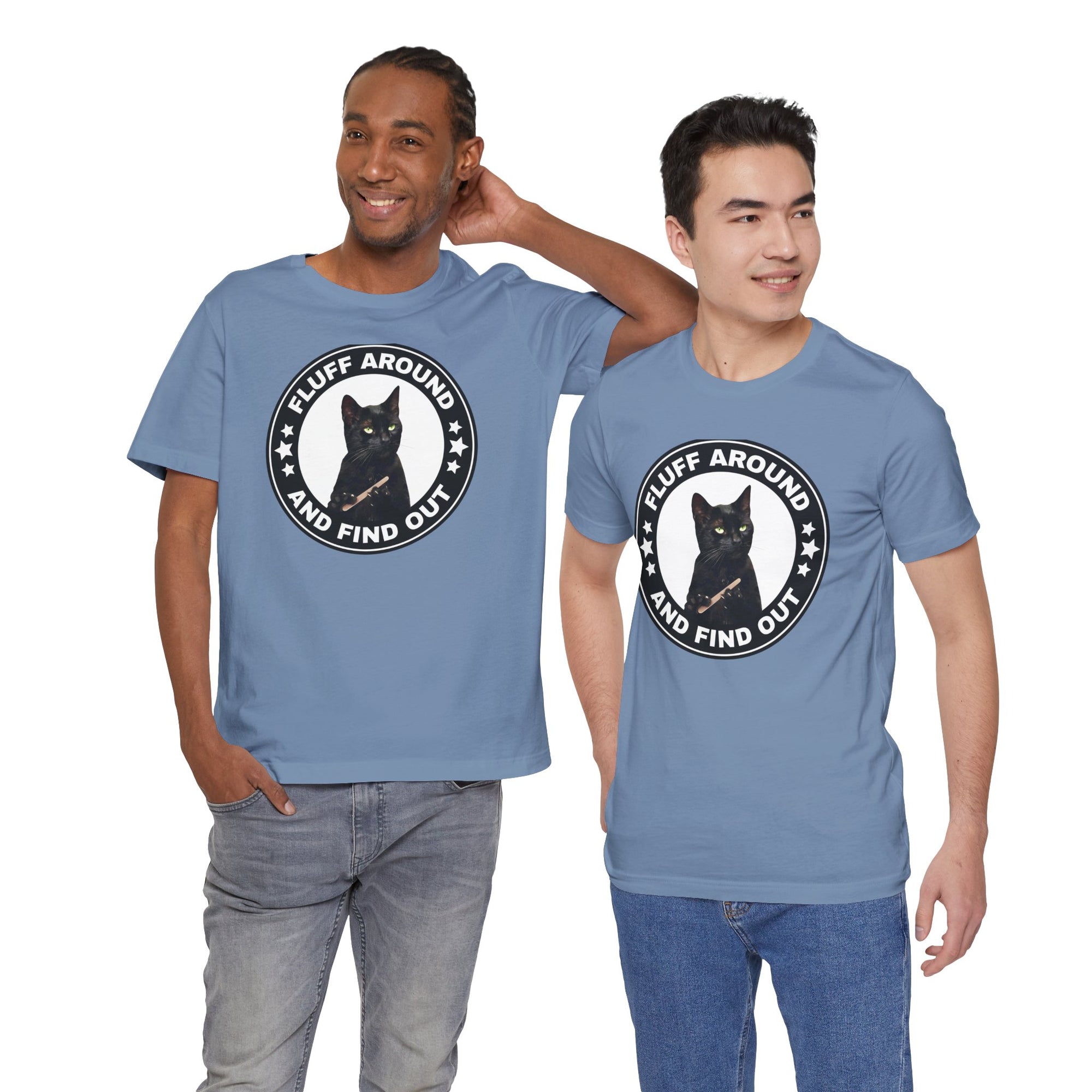 Two men wearing blue t-shirt featuring a circular badge design with a black cat and the phrase “Fluff Around and Find Out.”