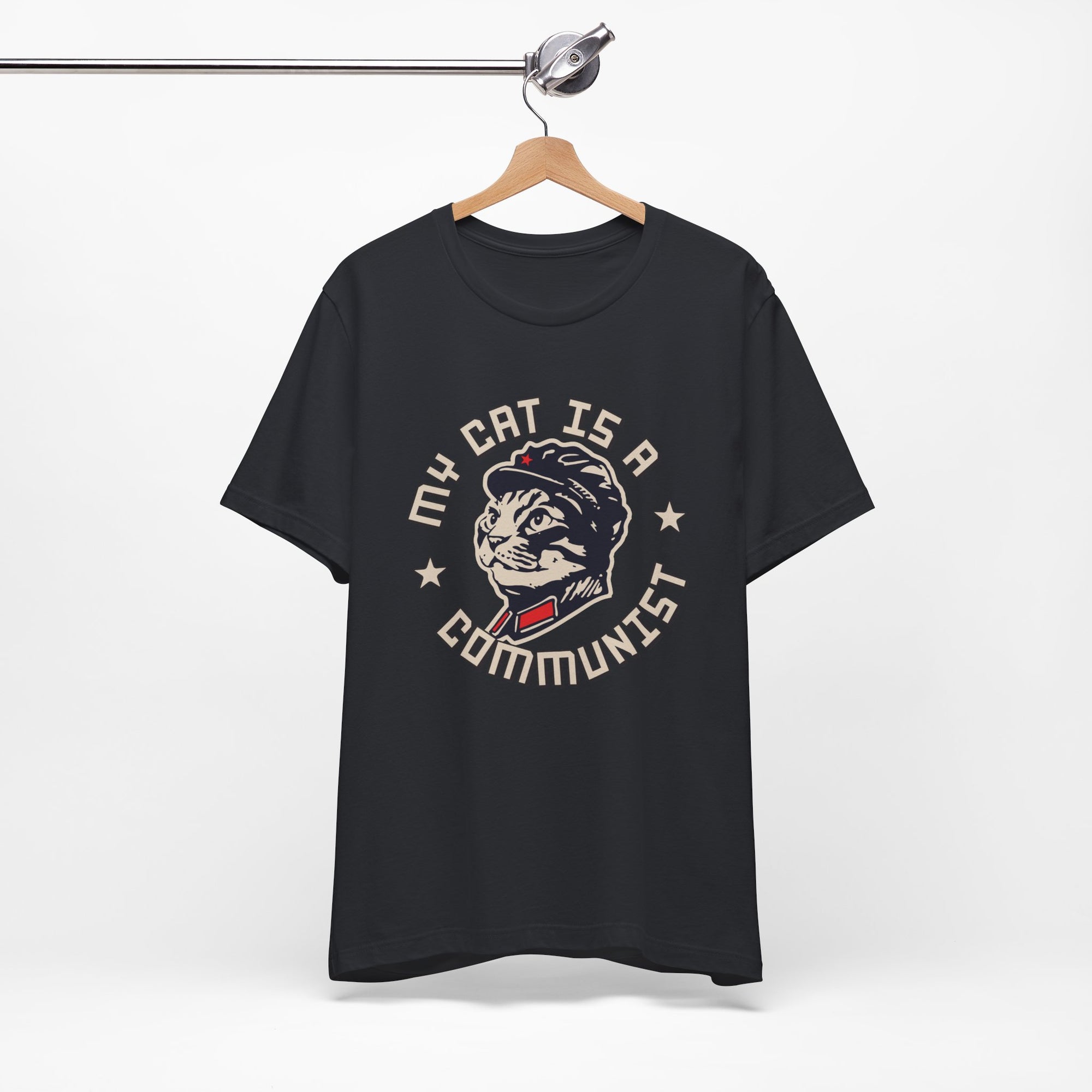 Black t-shirt with a graphic design of a cat and text on a hanger against a white background