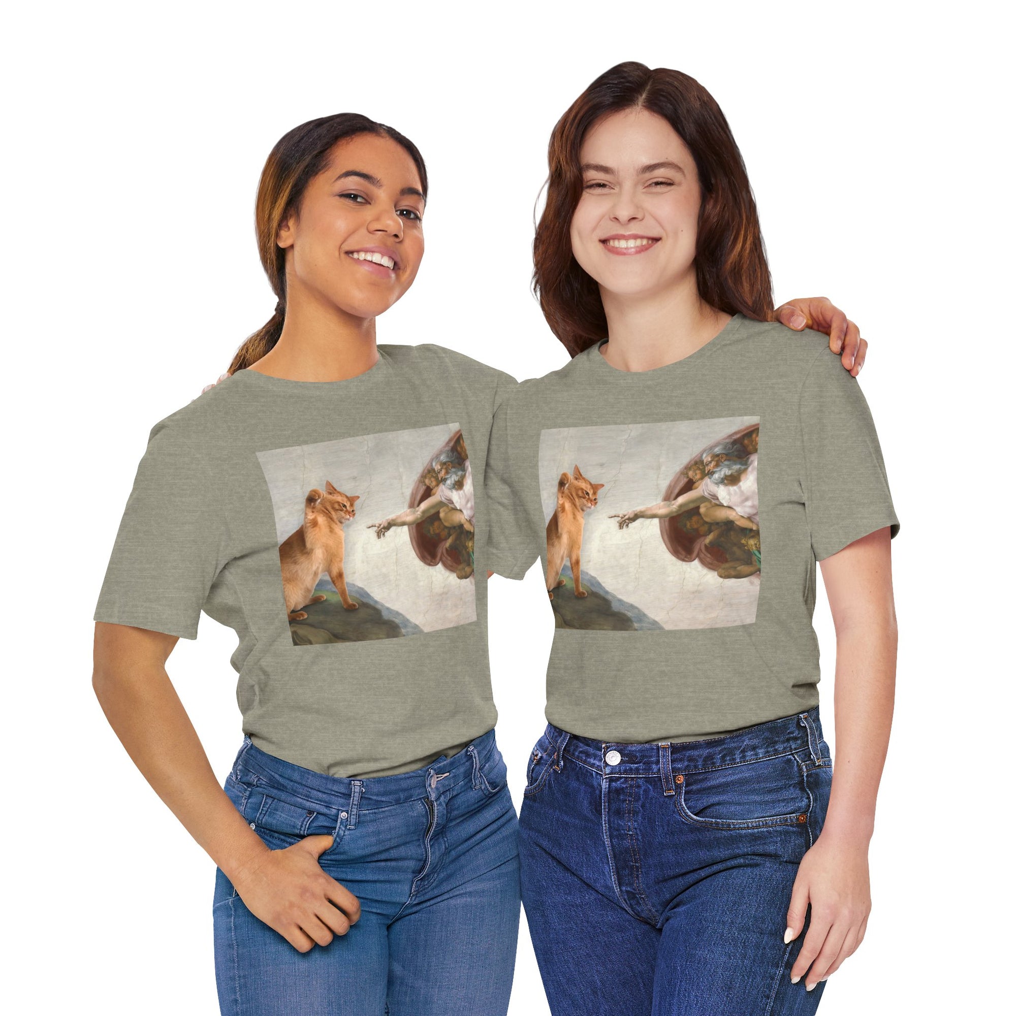 Two people wearing green t-shirts with a graphic design of a fox and angel on a white background