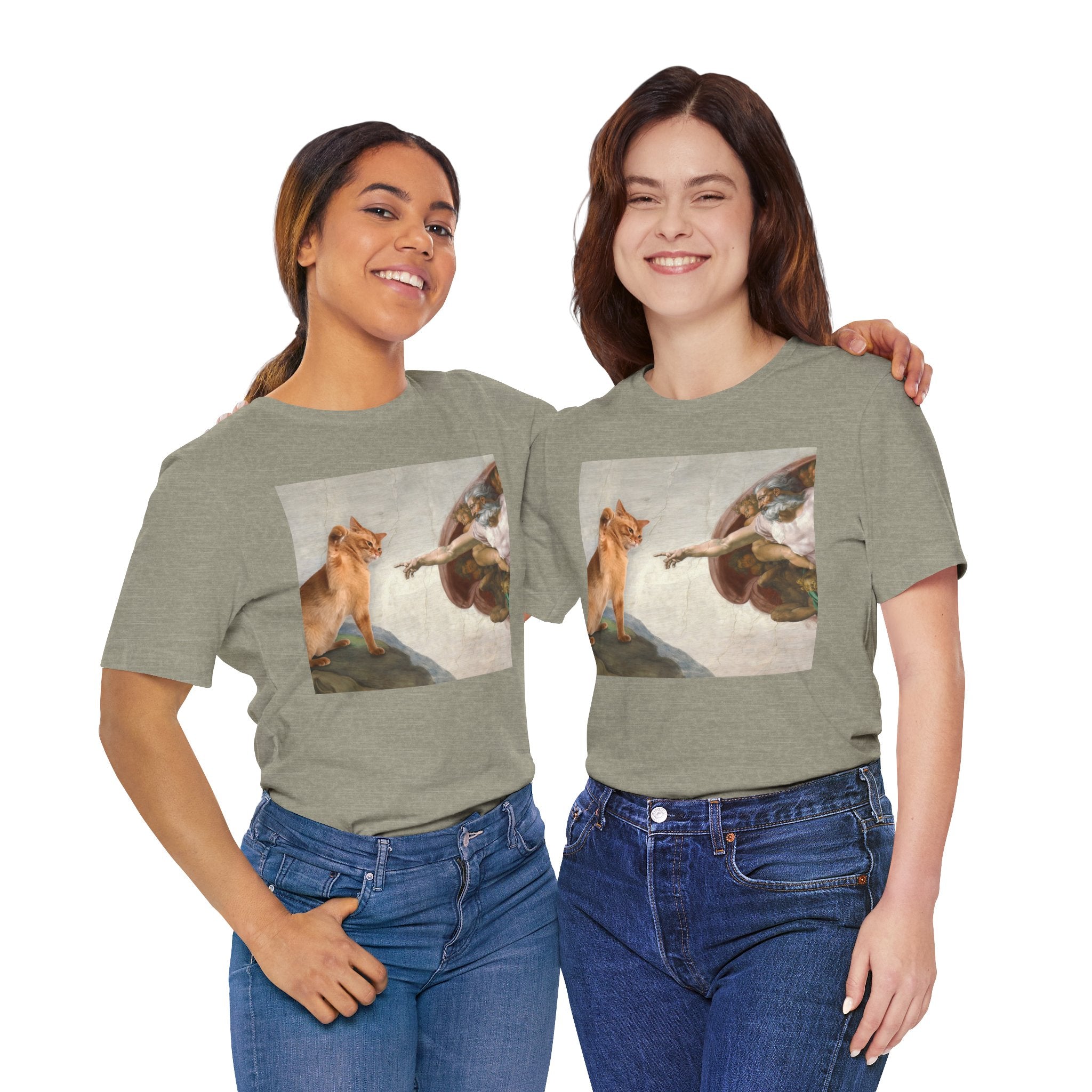 Two people wearing green t-shirts with a graphic design of a fox and angel on a white background