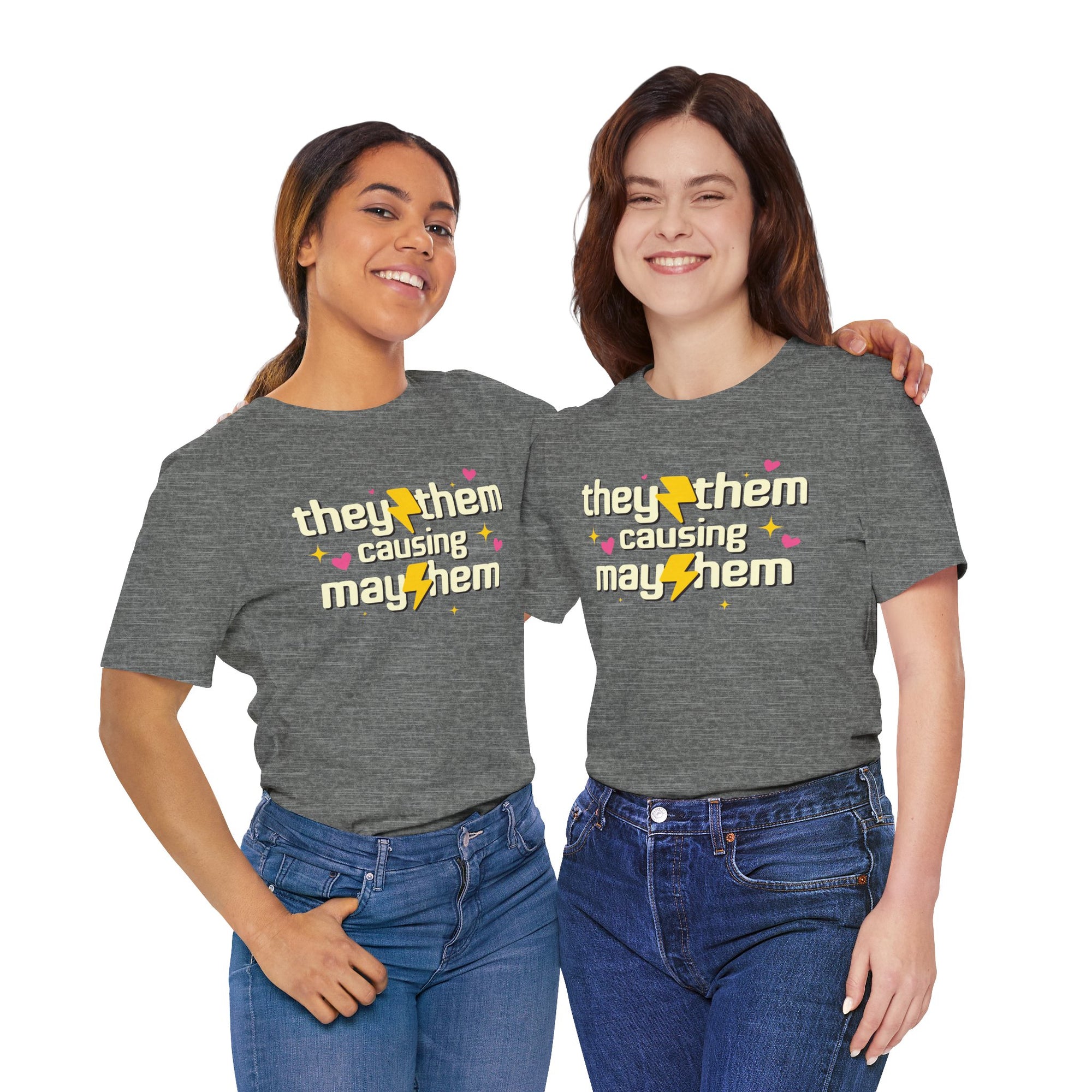 Two women wearing gray t-shirts with a printed design on a white background