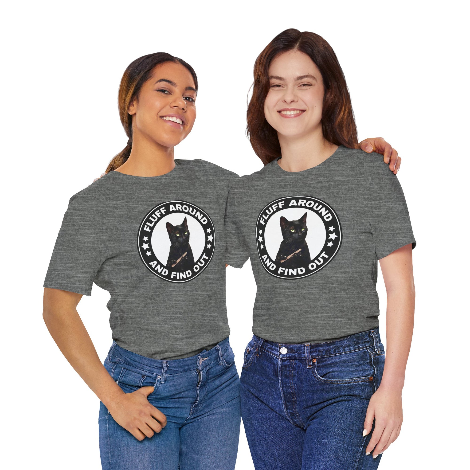 Two people wearing grayt-shirt featuring a circular badge design with a black cat and the phrase “Fluff Around and Find Out.”