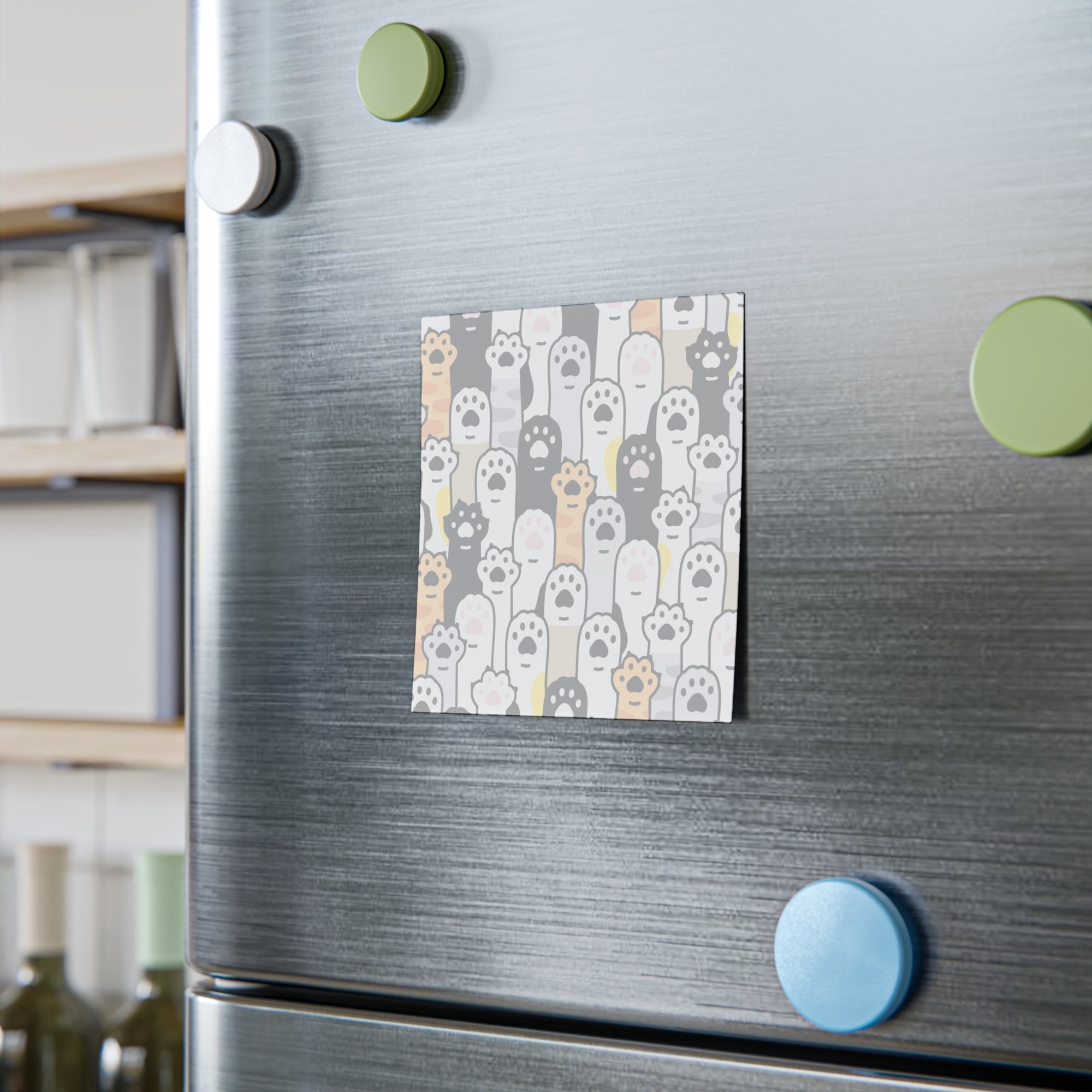 Fridge with a decorative post it featuring paw prints on a gray background