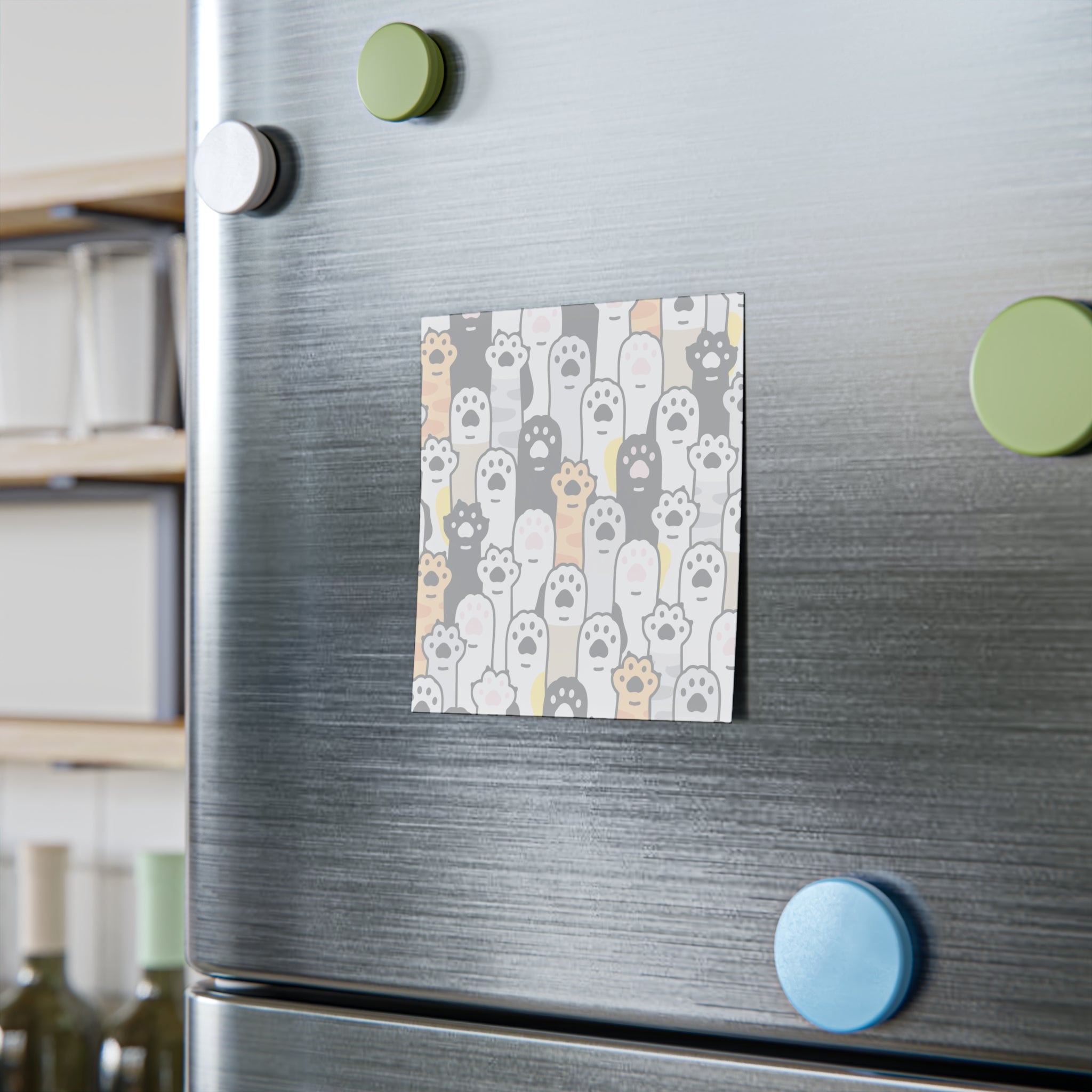 Fridge with a decorative post it featuring paw prints on a gray background