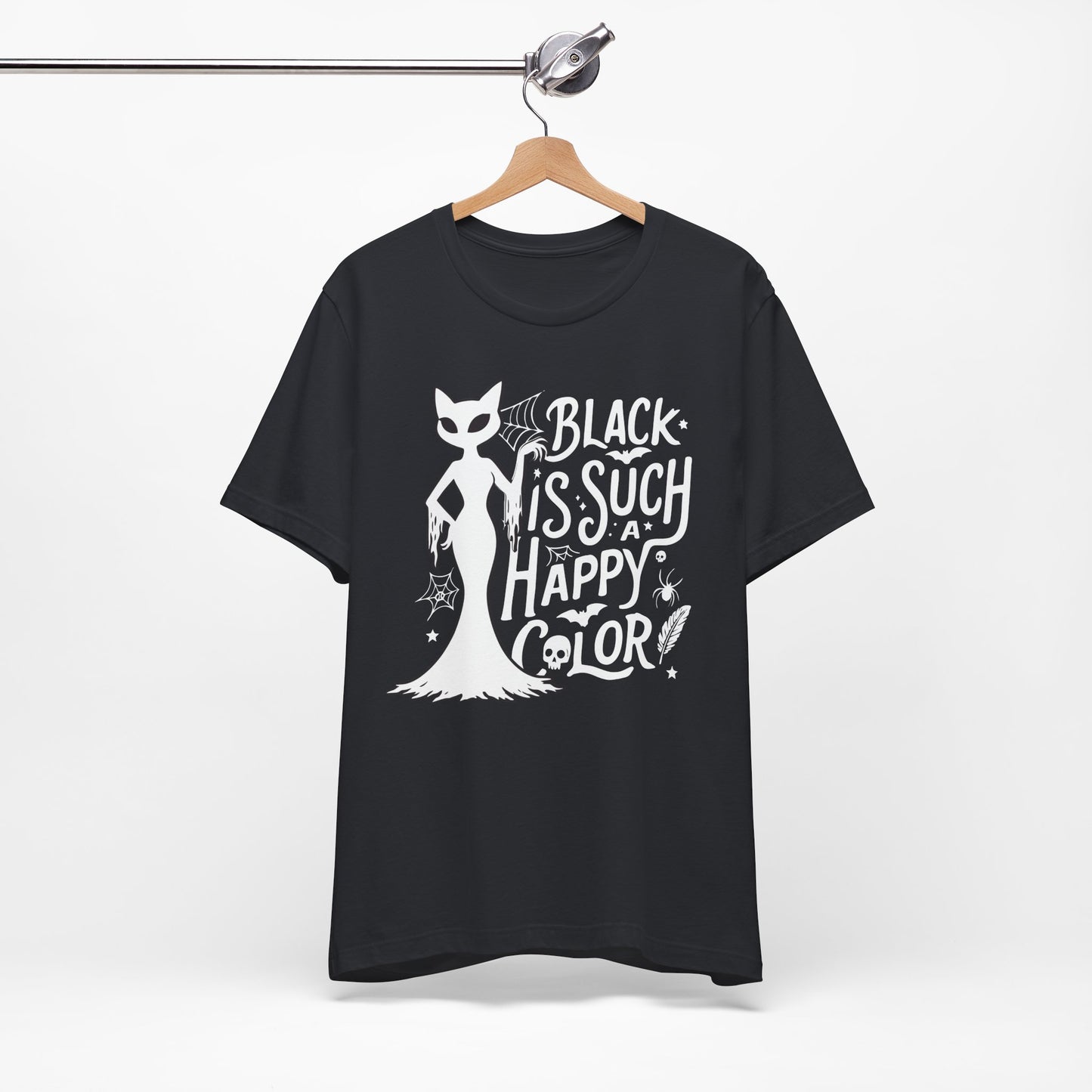 Black t-shirt featuring a white spooky cat graphic with the phrase “Black Is Such a Happy Color,” plus bats, spiderwebs, stars, and Halloween details.
