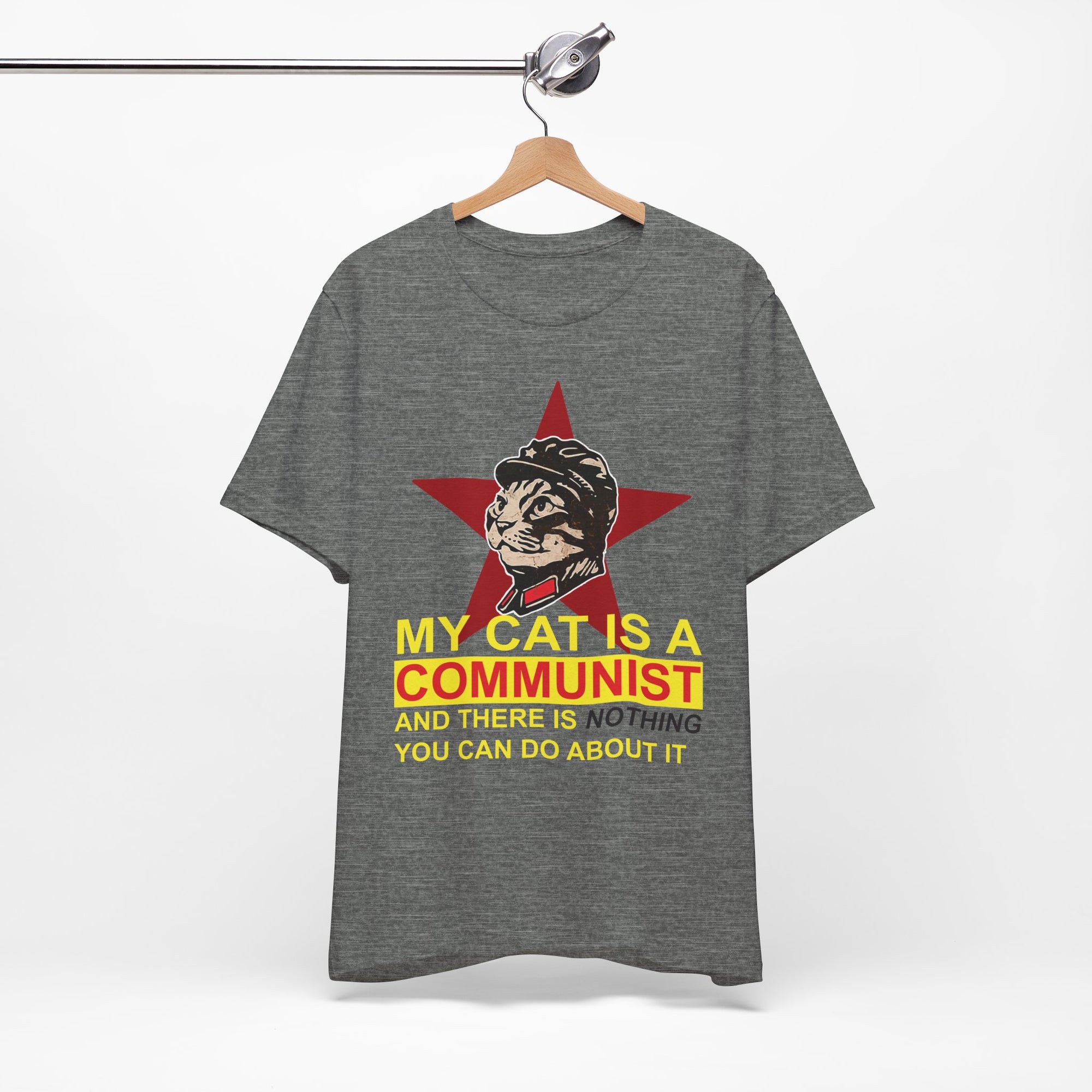 Gray t-shirt with a graphic of a cat in a communist uniform and star, text 'My cat is a communist and there is nothing you can do about it', on a hanger against a white background.