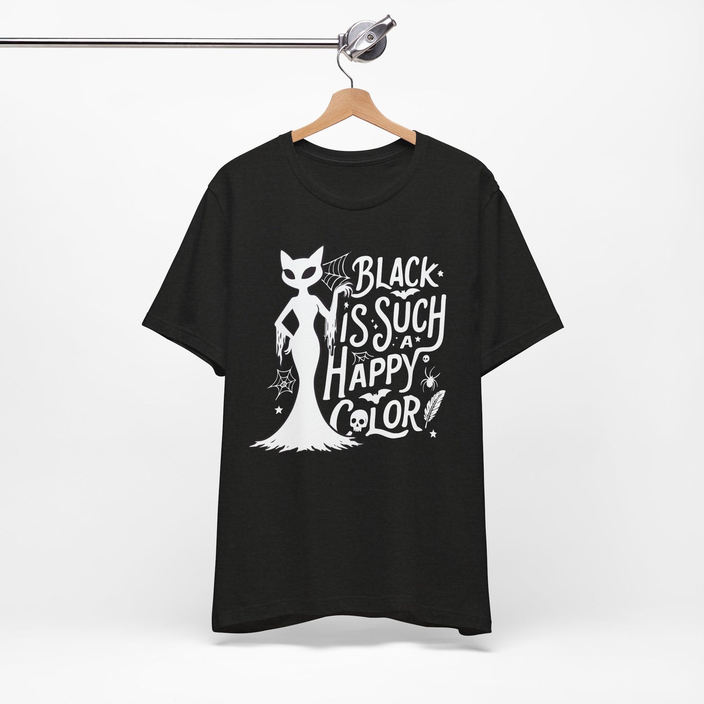 Black t-shirt featuring a white spooky cat graphic with the phrase “Black Is Such a Happy Color,” plus bats, spiderwebs, stars, and Halloween details.
