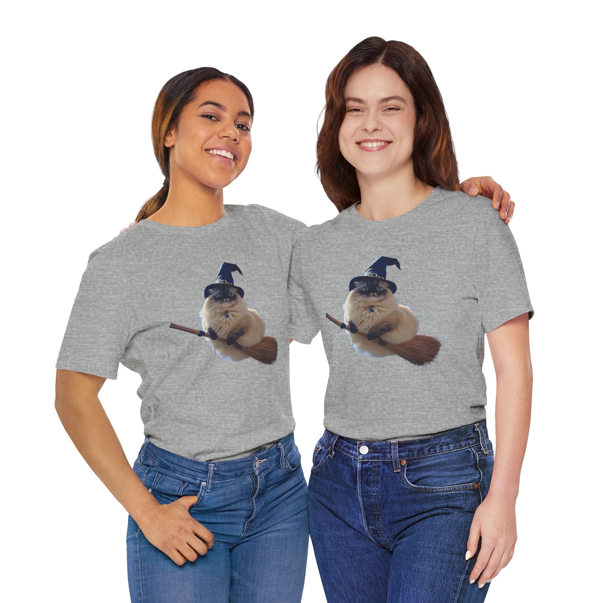 Two women wearing gray t-shirts with a graphic of a cat wearing a witch hat and holding a broomstick.
