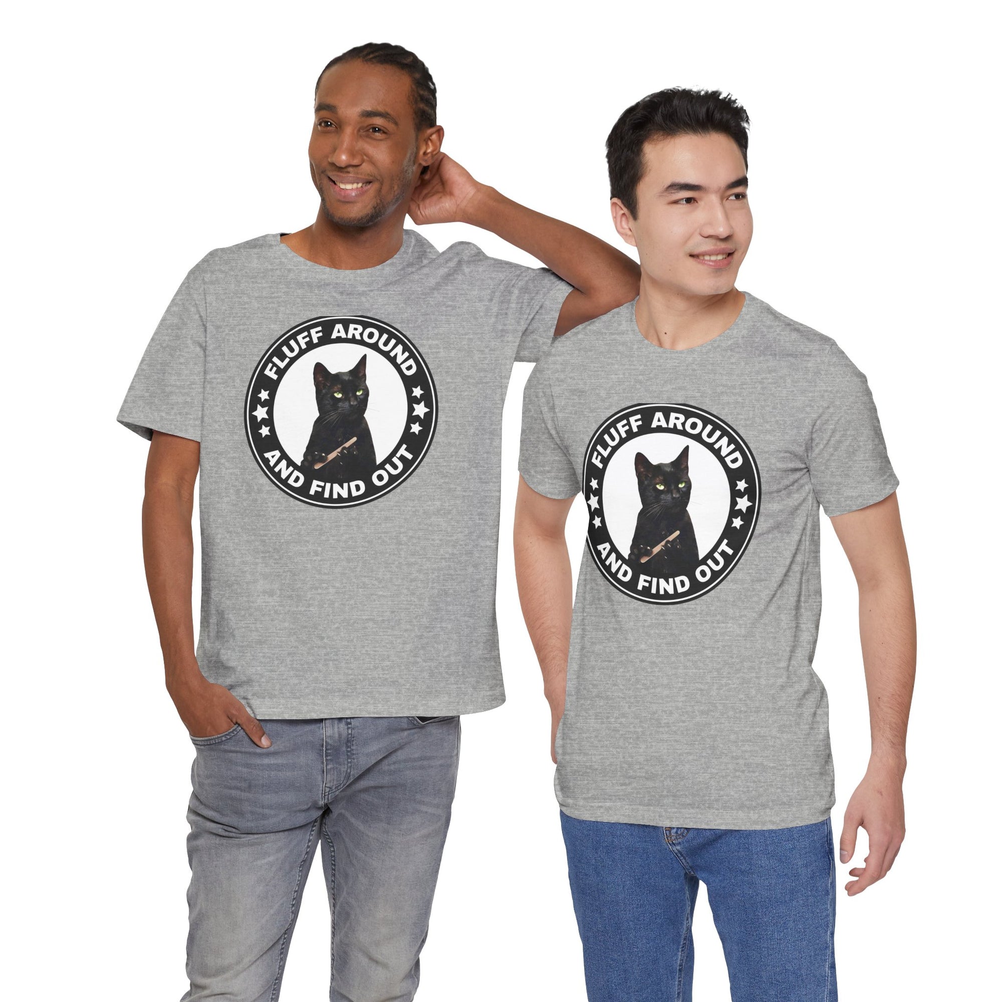 Two men wearing gray t-shirt featuring a circular badge design with a black cat and the phrase “Fluff Around and Find Out.”