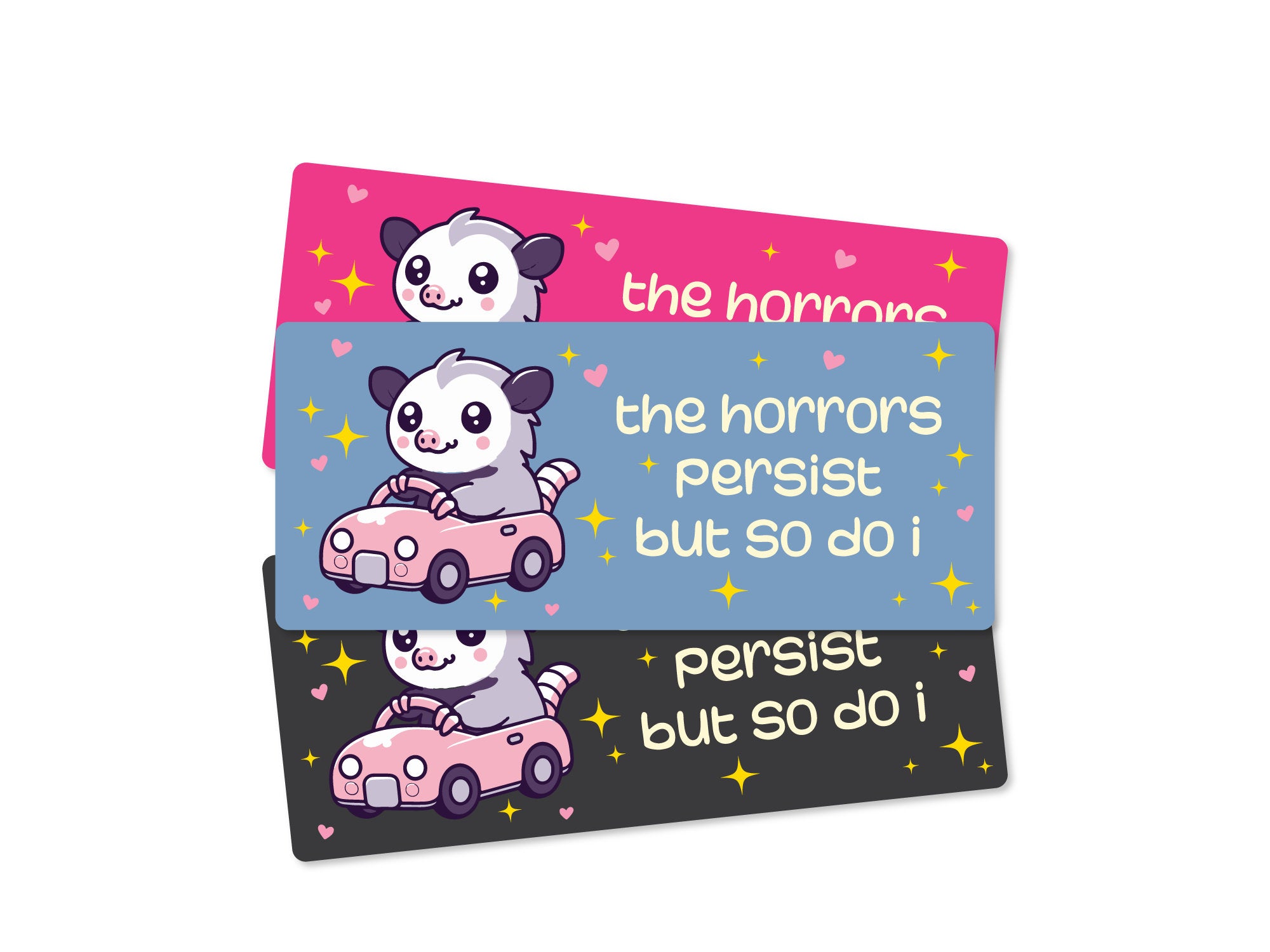 Three rectangular bumper stickers that say “the horrors persist but so do i,” featuring a cute possum driving a pink car with hearts and sparkles in pink, blue, and dark gray color options.
