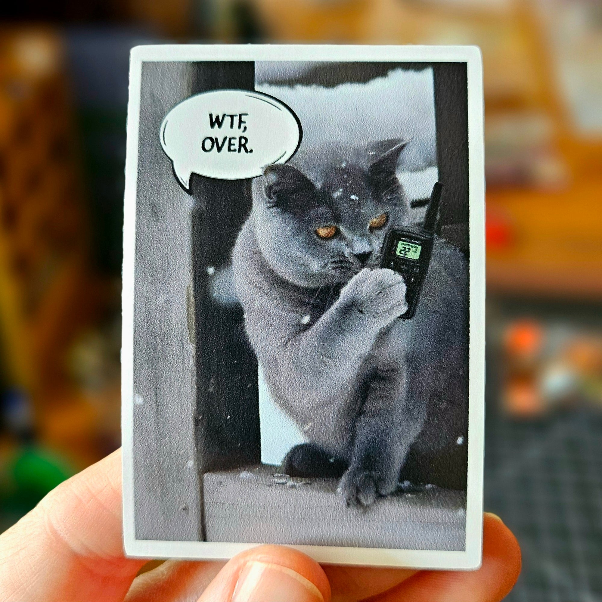  cat vinyl stickers featuring cats holding walkie talkies with speech bubbles that say “WTF, over.”
