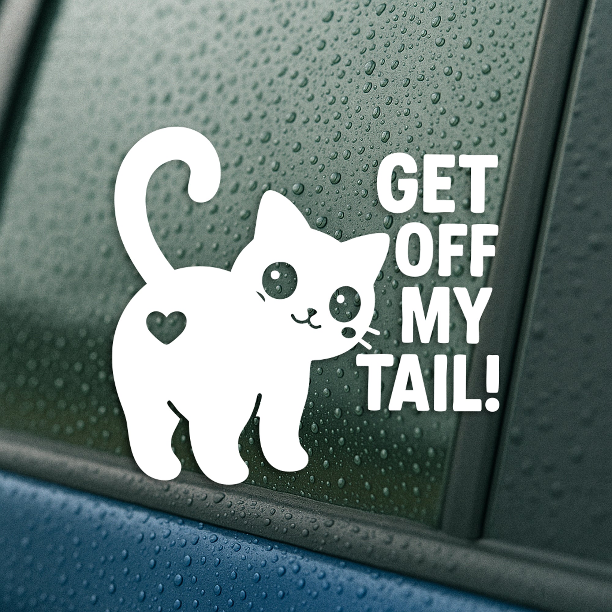 White vinyl decal on a rainy car window featuring a cute cat with a raised tail and bold text that says “Get Off My Tail!”
